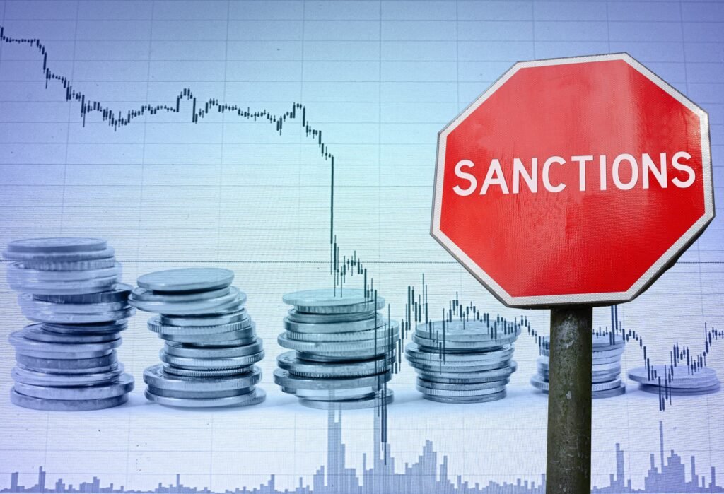 Conceptual diagram showing restricted financial networks and blocked trade routes representing economic sanctions.