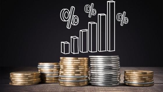 Illustration showing the two main central bank tools: a rising interest rate dial and a shrinking balance sheet chart for QT.